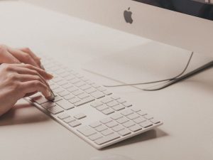 Image of hands typing on a keyboard