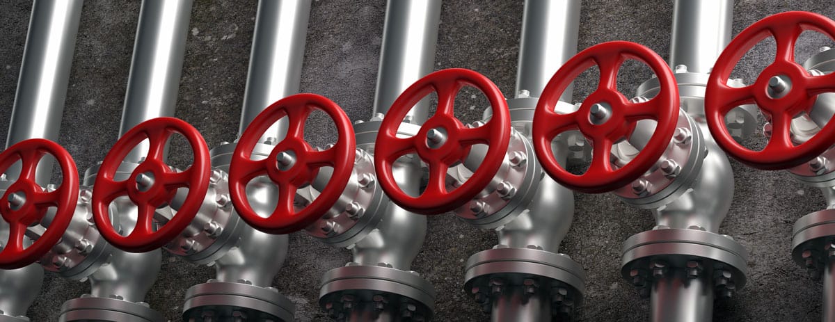 plumbing pipes with red knobs