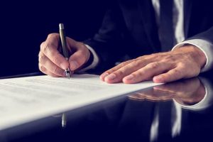 A client signing a contract with a lawyer