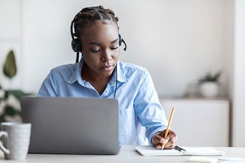 woman using AI on computer to complete tasks 