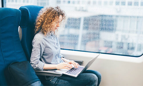 Lady looking at lick tracking data on a train