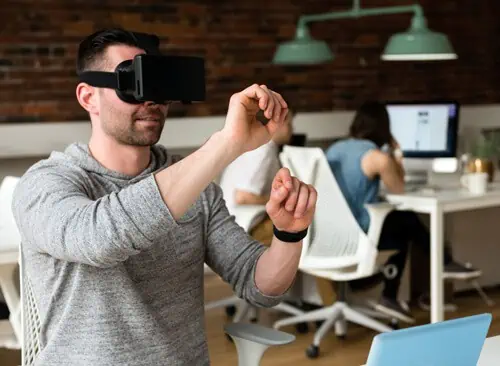 Guy in a VR mask experiencing integrated marketing