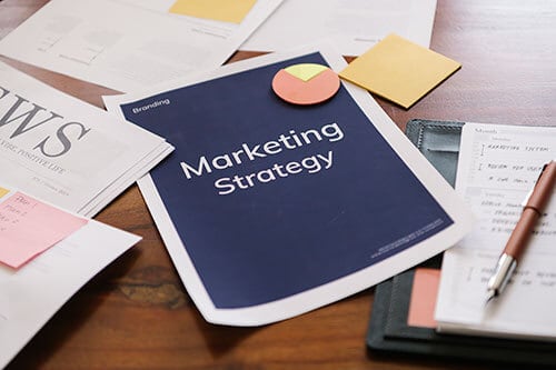 Marketing strategy on paper to help with business innovation consulting services 