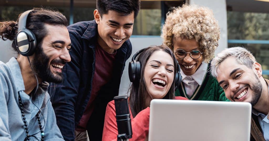 a bunch of people listening to a podcast from a computer